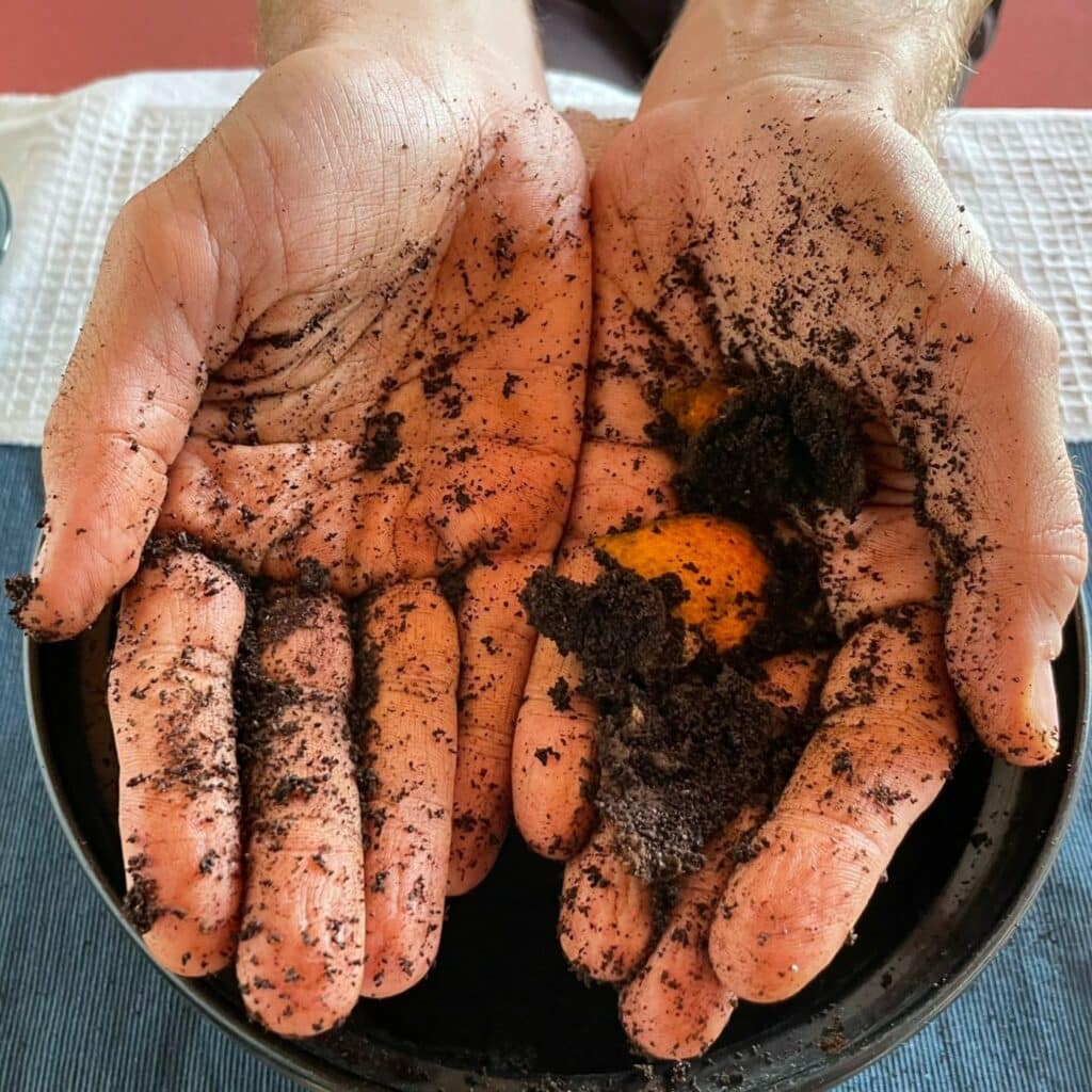 hands covered in soil
